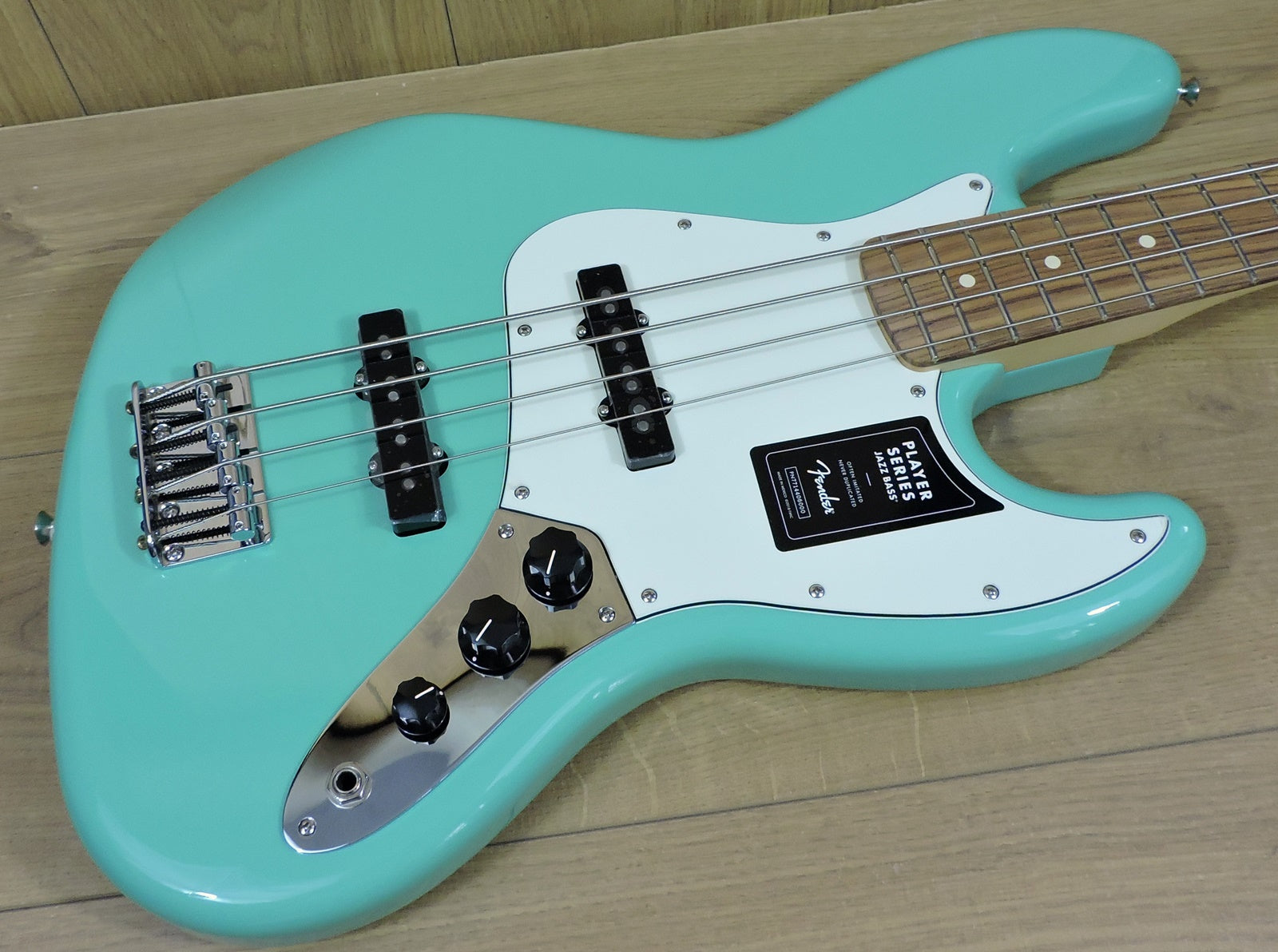 Teal deals bass guitar